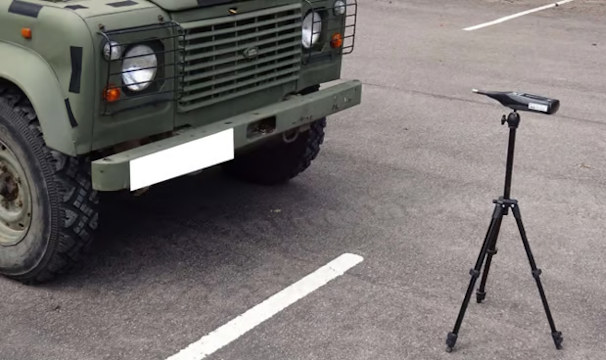 Test setup showing a Land Rover and acoustic equipment